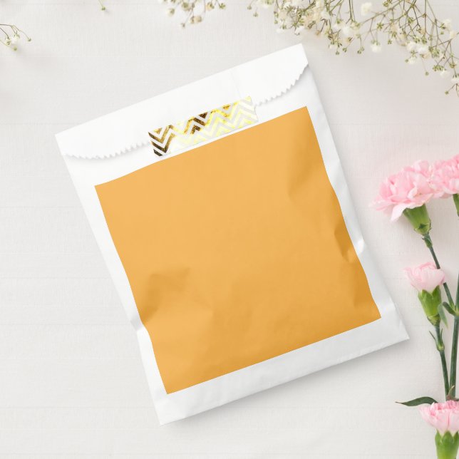 a yellow background with a favour bag (Sealed)