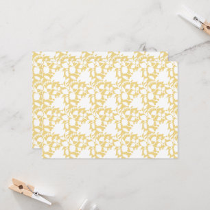 A yellow rug with a repeating motif pattern resemb invitation