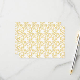 A yellow rug with a repeating motif pattern resemb RSVP card