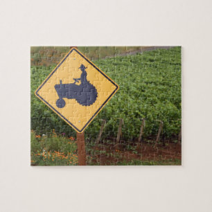 A yellow tractor crossing sign in the vineyard jigsaw puzzle