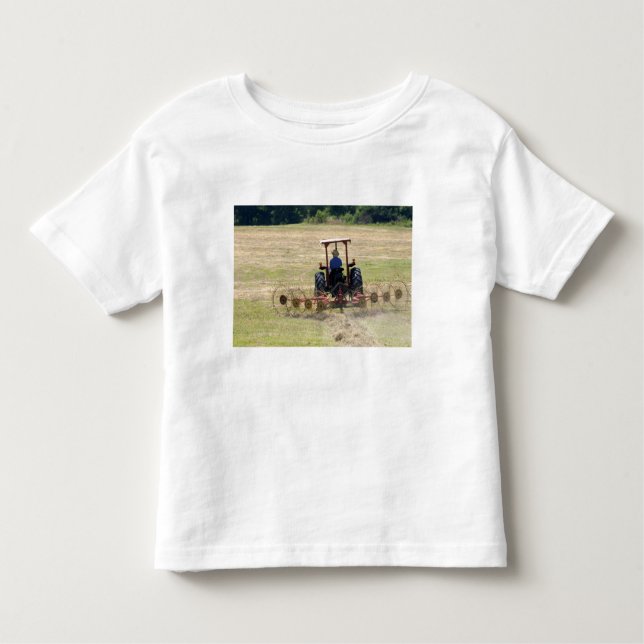A young boy driving a tractor harvesting toddler T-Shirt (Front)