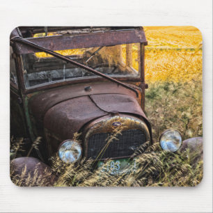 Abandoned old car in tall grass mouse pad