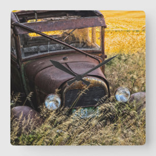 Abandoned old car in tall grass square wall clock