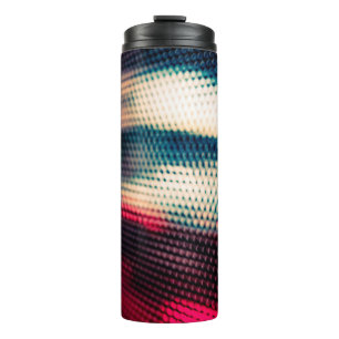 abstract background with bokeh defocused lights an thermal tumbler