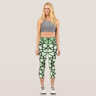 Abstract black lines pattern on light green capri leggings