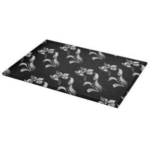Abstract black white shine flowers on black cutting board