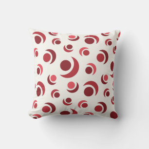 Abstract circles and crescents in red cushion