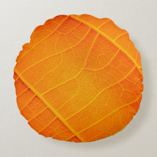 Abstract closeup of an orange and yellow leaf text round cushion