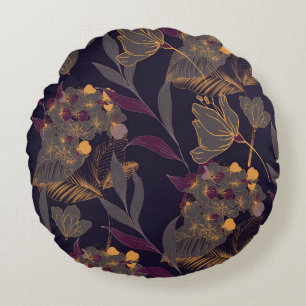 Abstract drawing of flowers and leaves on a golden round cushion