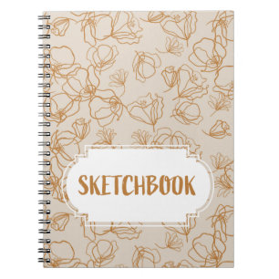 Abstract flowers over beige notebook