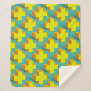 Abstract geometric texture of yellow crosses on a sherpa blanket