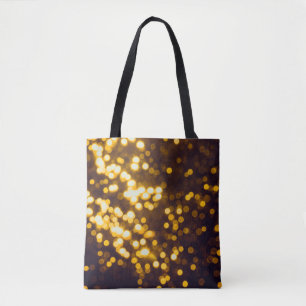 Abstract gold bokeh with black background tote bag