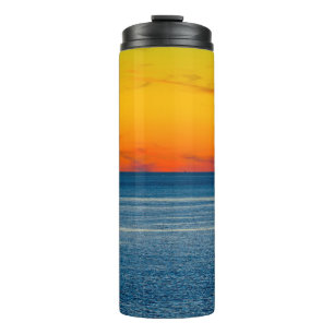 Abstract long exposure seascape with intentional c thermal tumbler