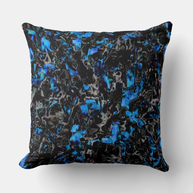 Abstract looking bat wings over stained turquoise cushion (Front)