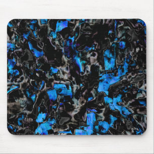 Abstract looking bat wings over stained turquoise mouse pad