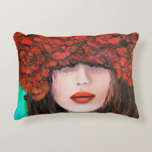 Abstract oil painting showing woman face and red r decorative cushion