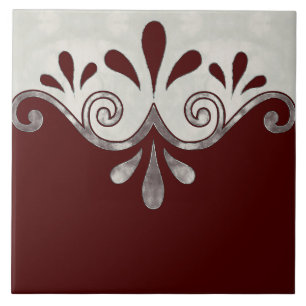 Abstract ornamental shape in burgundy and silver ceramic tile