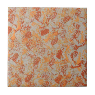 Abstract painting of orange on grey trivet tile