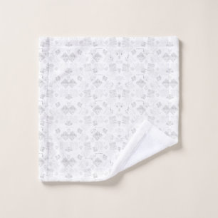 Abstract repeating pattern of stylised shapes in l bath towel set