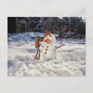 Acorn elf making a snowman winter postcard