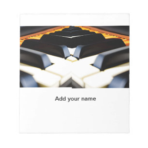 Add you name text brown black piano keys notepad