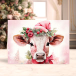 Adorable Christmas Cow in Santa Hat Holiday Card<br><div class="desc">Spread holiday cheer with our Adorable Christmas Cow in Santa Hat Holiday Card! This charming card features a sweet illustration of a cute cow wearing a festive Santa hat, set against a soft, snowy background with delicate holiday decorations. Perfect for sharing joyful wishes with friends and family, this card captures...</div>