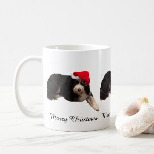 Adorable dog wearing a santa hat on a Christmas Coffee Mug