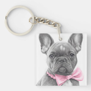 Adorable french bulldog puppy with a pink bow key ring