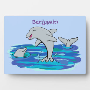 Adorable happy dolphins cartoon illustration plaque