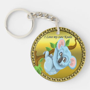 Adorable koala bear hanging on a tree branch key ring