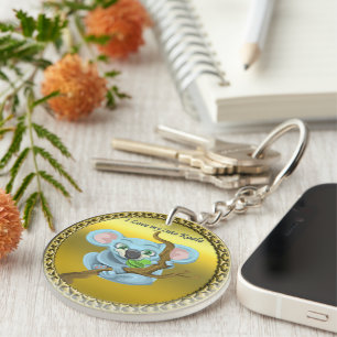 Adorable koala bear in a tree in the forest key ring