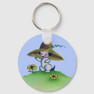 adorable puppy dog wearing big straw hat key ring