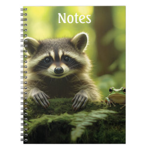 Adorable Raccoon and Frog Peeking Over Mossy Log i Notebook