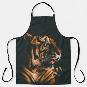 ADULT TIGER PRONE LYING INSIDE DIM LIGHTED ROOM APRON