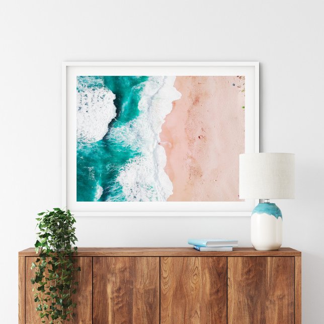Aerial Beach Poster Print (Aerial Beach Poster Print in a white frame above a wooden small furniture.)