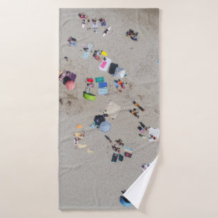 Aerial photo of people sunbathing on the beach bath towel