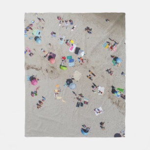 Aerial photo of people sunbathing on the beach fleece blanket