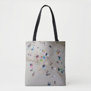 Aerial photo of people sunbathing on the beach tote bag