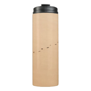Aerial photography of footprints in the sand thermal tumbler