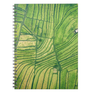 Aerial photography of green farm field notebook