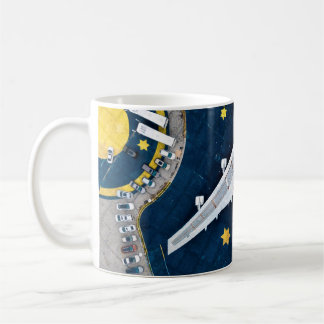 AERIAL PHOTOGRAPHY OF WHITE AND BLACK AIR LINER ON COFFEE MUG