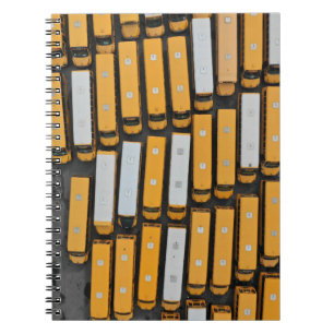 Aerial photography of white and yellow buses notebook