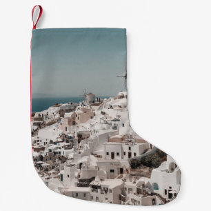 AERIAL PHOTOGRAPHY OF WHITE CONCRETE BUILDINGS DUR SMALL CHRISTMAS STOCKING