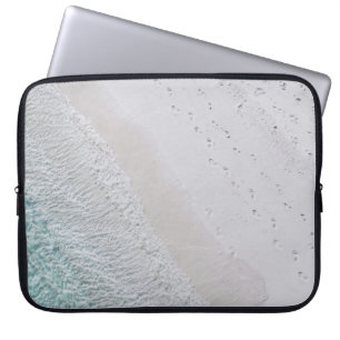 AERIAL PHOTOGRAPHY OF WHITE SAND SEASHORE AND GREE LAPTOP SLEEVE