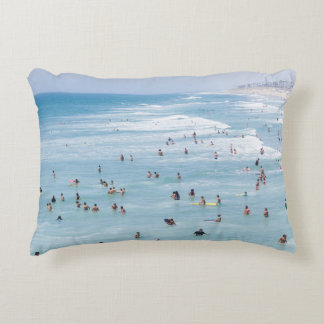 AERIAL VIEW OF GROUP OF PEOPLE SWIMMING ON BEACH DECORATIVE CUSHION