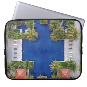 Aerial view of pool surrounded by palm trees laptop sleeve