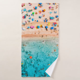Aerial view of sandy beach with colorful umbrellas bath towel