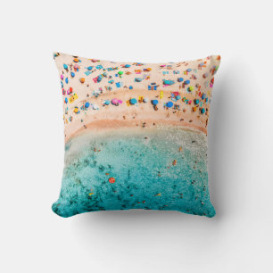 Aerial view of sandy beach with colorful umbrellas cushion