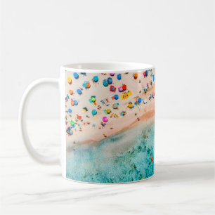 Aerial view of sandy beach with colourful umbrella coffee mug