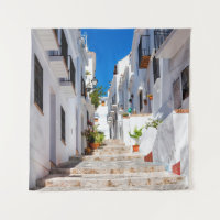 Aerial view of white city Frigiliana in sunny day
